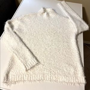 Never been worn. Cozy and soft white Steve Madden sweater. In perfect condition.
